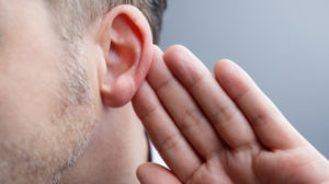 Man-with-hand-on-ear-listening-for-quiet-sound | Feature | Researchers Find Epigenetic Link To Noise-Induced Hearling Loss
