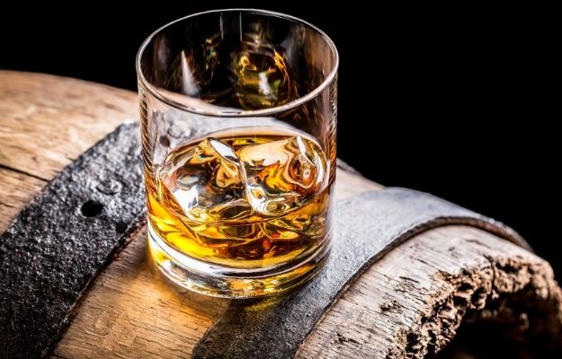 a shot of whisky with ice | Epigenetics And Aging: How Some People Are Able To Age Better